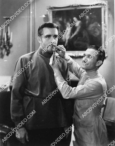 Jack Pierce does finishing makeup for John Boles 5623a-19