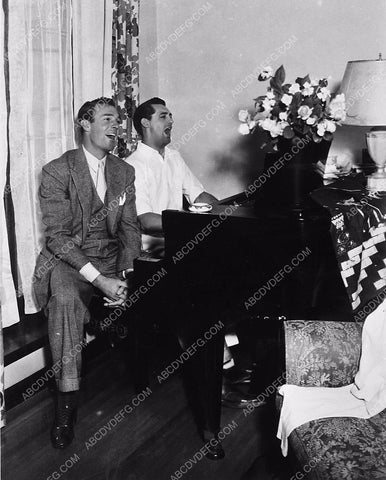 Randolph Scott Cary Grant sitting and singing at the piano 5765a-12