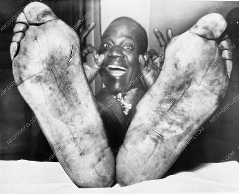 candid Bill Robinson marches in parade all day and wears out his feet 5845-04