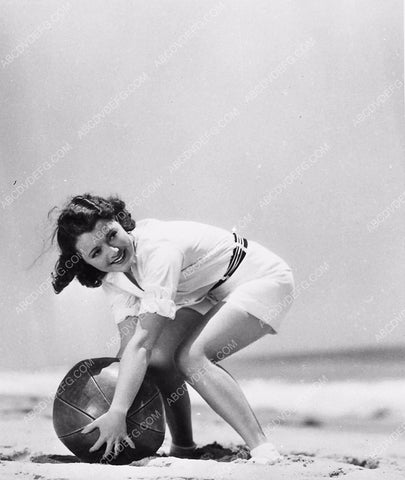 Janet Gaynor on the beach playing w her beach ball 6016-06
