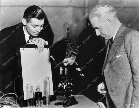 Clark Gable Myrna Loy behind the scenes looking through a microscope 6572-35