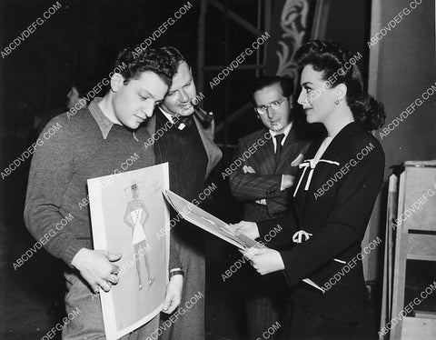 Jules Dassin Joan Crawford look at costume wardrobe sketches on set film Reunion in France 6573-36