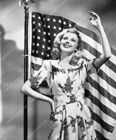 beautiful Dolores Moran does patriotic wave w American Flag 6832-23