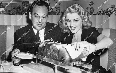 candid Dolores Moran and someone carving up a pig I think 6851-018