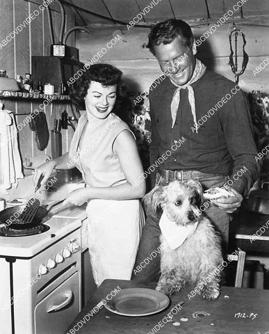 candid Barbara Hale, Joel McCrea & the dog cooking in the trailer on location film The Lone Hand 6861-014