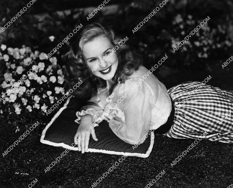 lovely Deanna Durbin laying in the grass 7022-024