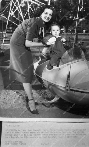 candid Jane Russell at a park with a kid 7169-07