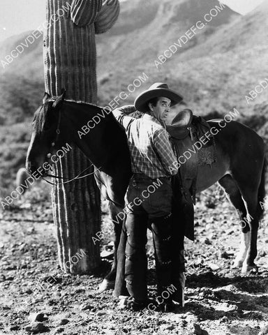 Frank Rice w his horse and a cactus 7388-13