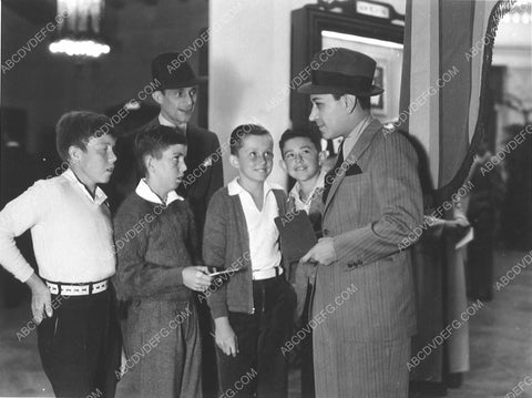 great candid George Raft signs autographs for a bunch of kids 7541-07