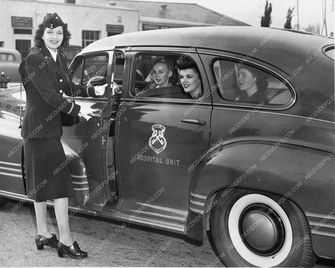 Kay Francis helping the war effort transporting babes in hospital unit car 7566-27