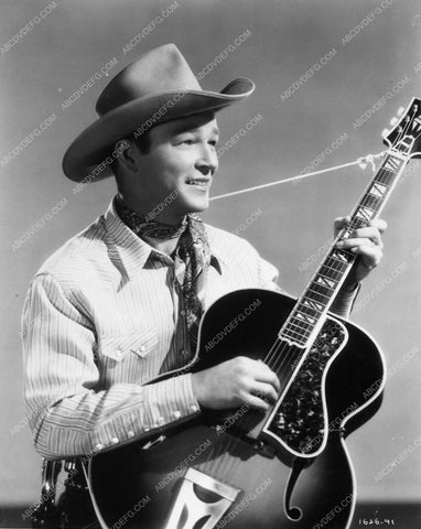 Roy Rogers strumming away on his guitar 7600-25