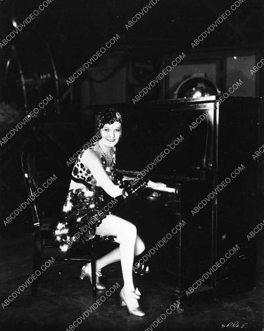 Marion Nixon sitting at the piano behind the scenes 7762-07