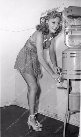 pretty lady hits the water cooler for refreshment 81bx01-146