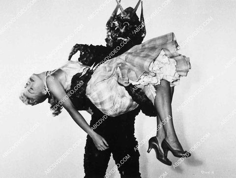 Lori Nelson in the clutches of the monster film Day the World Ended 8444-17