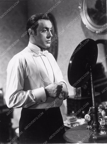 Charles Boyer putting on his tux film Gaslight 8969-11