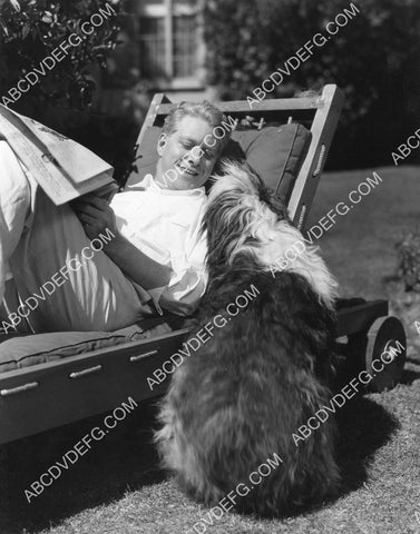 Nelson Eddy at home playing w his dog 8B11-761