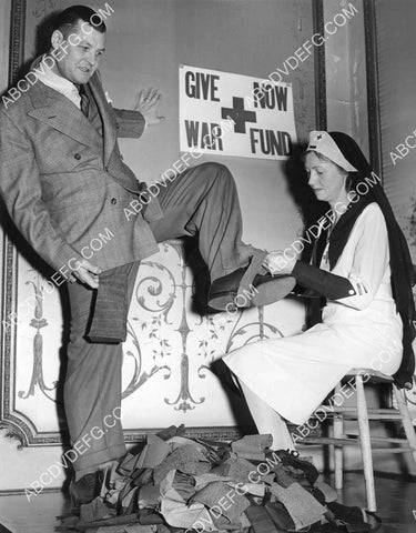 WWII Red Cross war effort William C Prescott gets trousers cut for wool drive 8B11-815