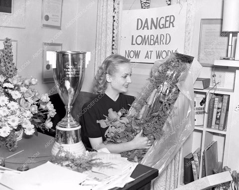 Carole Lombard in her office with trophy 8b03-554