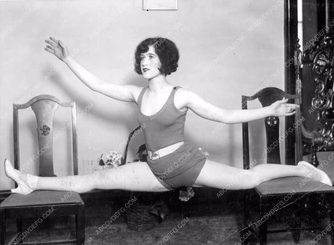 stage star Irene Swor does the splits on 2 chairs for exercise 8b6-018