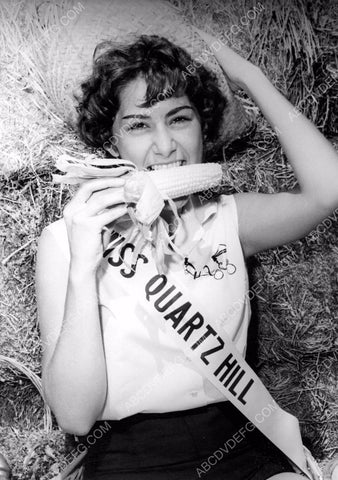 Sandra Pike 1962 Miss Quartz Hill enjoys sweet corn Antelope Valley Fair 8b6-077