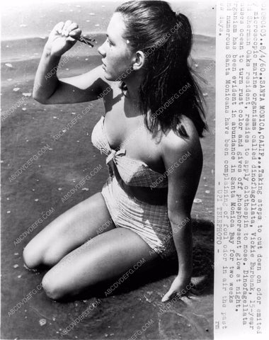 Vickie Burbank puts clothes pin on nose Santa Monica Beach 8b6-079