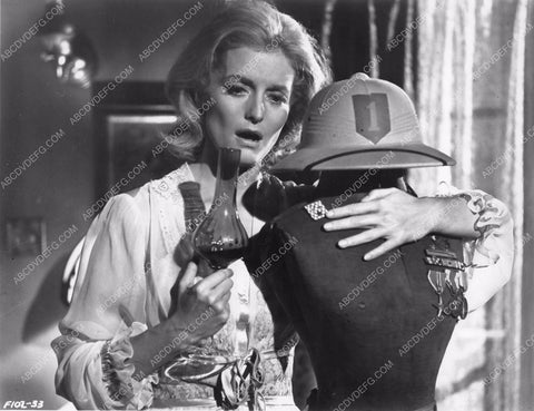 woman clutches fashion mannequin dummy with medals on chest 8b6-186