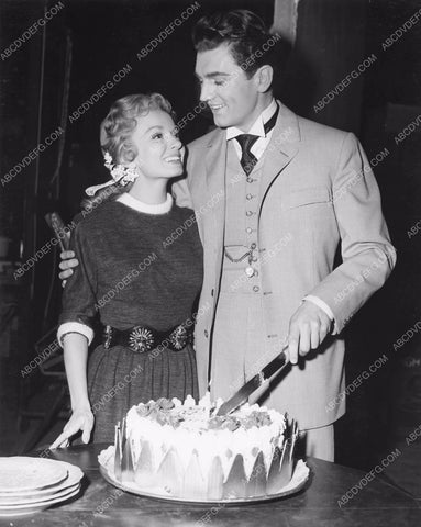 Ann Blyth helps Edmund Purdom w birthday cake on set Student Prince 8b6-476