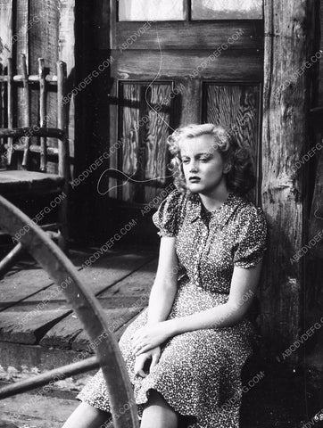 Jan Sterling sitting on the porch unknown film 9202-21