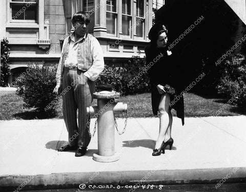 3 Stooges Moe Howard checking out the legs of lady flagging taxi 9223-33