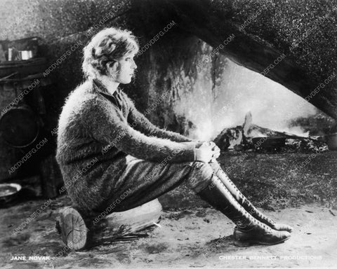 Jane Novak sielnt film star seated on log by campfire 9365-04