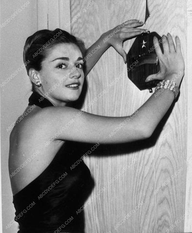 candid Anna Maria Alberghetti hanging award on wall 9365-08