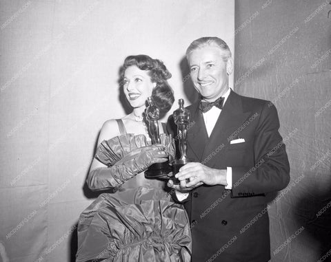1947 Oscars Loretta Young Ronald Colman statues Academy Awards aa1947-18</br>Los Angeles Newspaper press pit reprints from original 4x5 negatives for Academy Awards.
