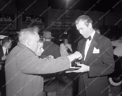 1951 Oscars James Stewart signs autograph at Academy Awards aa1951-36</br>Los Angeles Newspaper press pit reprints from original 4x5 negatives for Academy Awards.