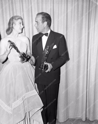 1954 Oscars Greer Garson Humphrey Bogart statues Academy Awards aa1954-56</br>Los Angeles Newspaper press pit reprints from original 4x5 negatives for Academy Awards.
