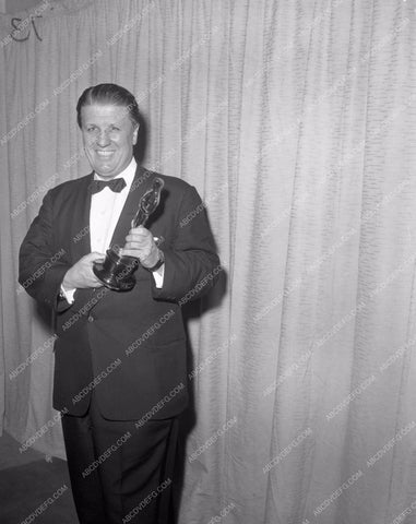 1957 Oscars George Stevens and his statue Academy Awards aa1956-49</br>Los Angeles Newspaper press pit reprints from original 4x5 negatives for Academy Awards.
