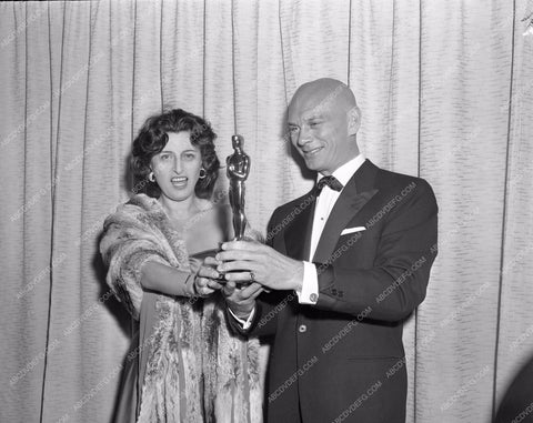 1957 Oscars Anna Magnani Yul Brynner statues Academy Awards aa1956-66</br>Los Angeles Newspaper press pit reprints from original 4x5 negatives for Academy Awards.
