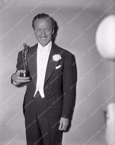 1958 Oscars David Niven and his statue Academy Awards aa1958-61</br>Los Angeles Newspaper press pit reprints from original 4x5 negatives for Academy Awards.