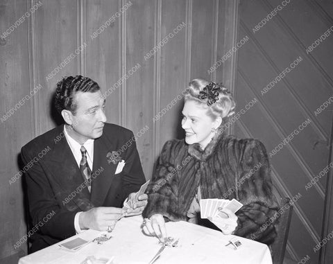 candid Alice Faye and Phil Harris playing cards afaye-09