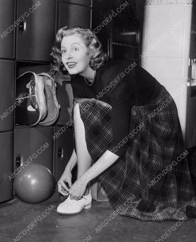 Arlen Dahl puts her bowling shoes on so she can play 8b20-0046