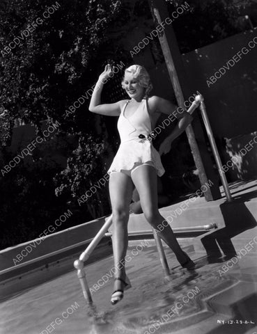 early film star Hazel Forbes testing the water in the swimming pool 8b20-0279