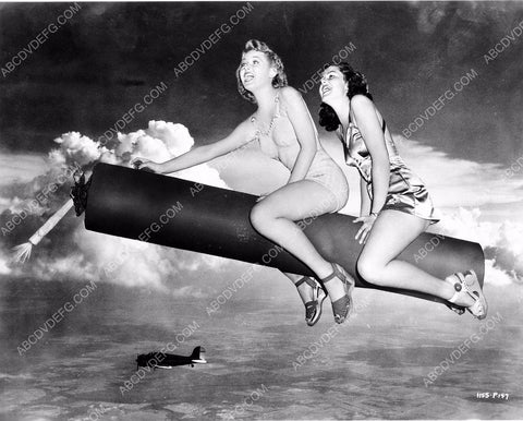 WWII pinup Jane Frazee and another on firecracker rocket 8b20-0295