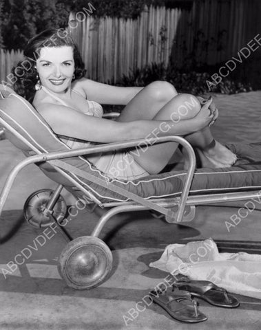 stunning Jane Russell in swimwear sitting in lounge chair 8b20-10054