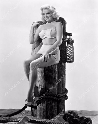 sexy Cleo Moore in bikini sitting on the pier post 8b20-10445