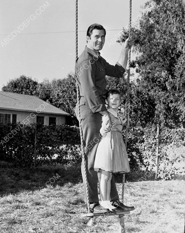 Clint Walker and daughter maybe on the swing set 8b20-10689