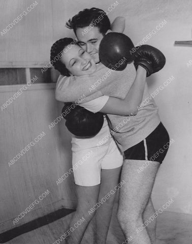 Dorothy Lamour dons boxing gloves for a little sparring w friend 8b20-12251