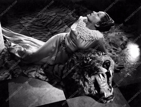 Gloria Swanson laying on tigerskin rug 8b20-12338