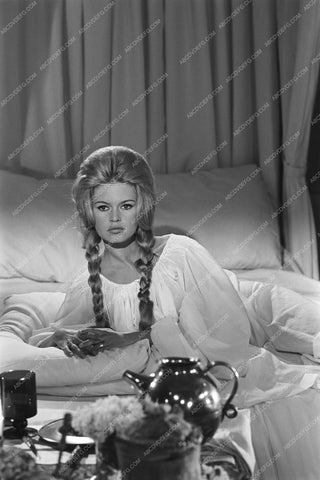 Brigitte Bardot laying on bed 8b20-12784