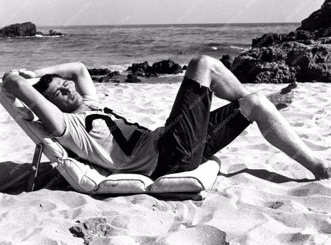 Gardner McKay relaxing on beach with feet in the sand 8b20-12899