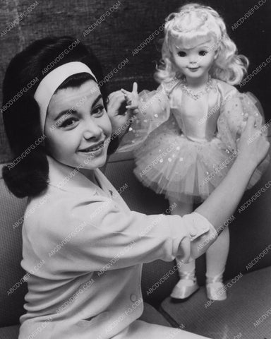 Annette Funicello showing off one of her dolls 8b20-13090