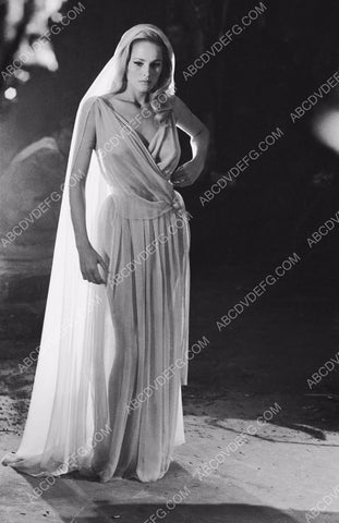 shapely Ursula Andress backlit in sheer white dress 8b20-13244